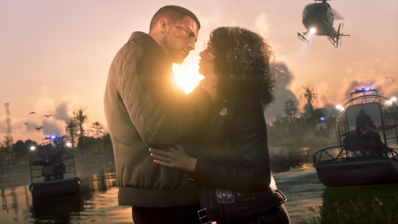Jason and Lucia embracing at sunset on the Vice City coast